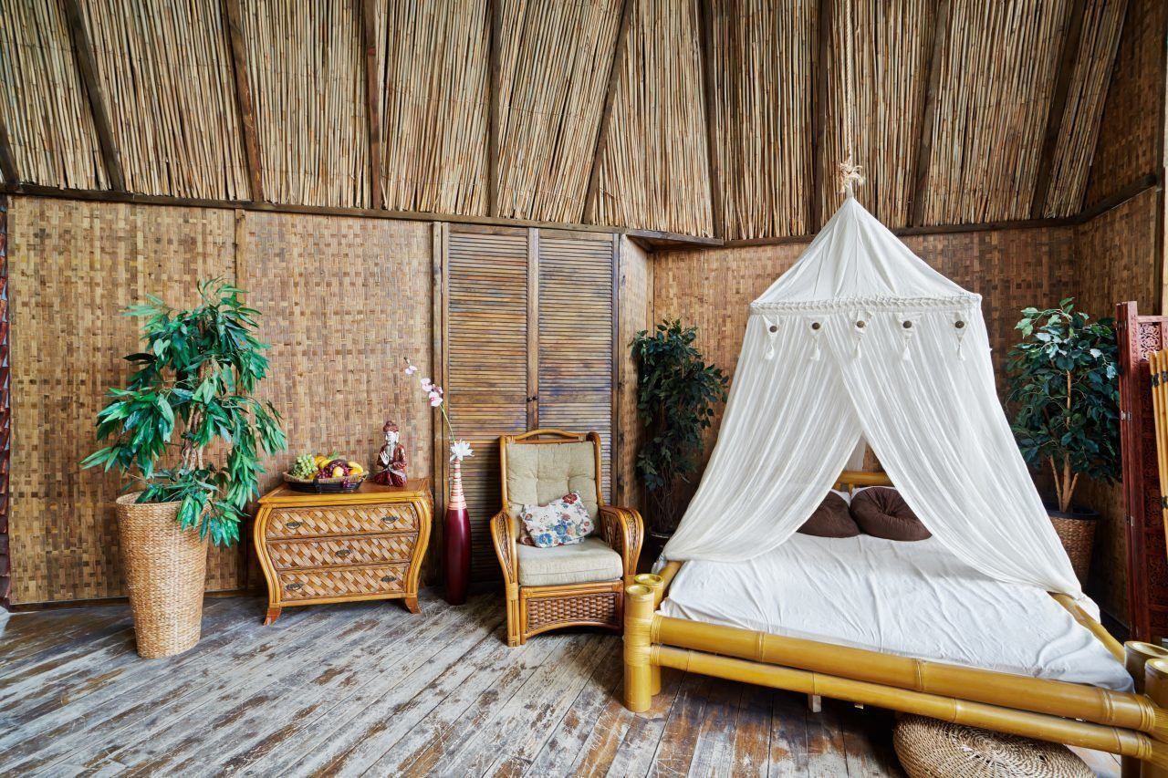Interior of house made of bamboo with bamboo bed